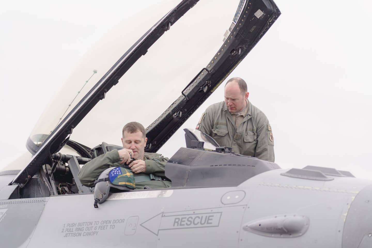 Lt. Col. Daniel Finnegan, a pilot, and Tech. Sgt. Frank Pastor, a crew chief, prepares Finnigan's F-16 Fighting Falcon for takeoff at the Vermont Air National Guard Base, South Burlington, Vt., April 6, 2019. (U.S. Air National Guard photo by Tech. Sgt. Ryan Campbell)