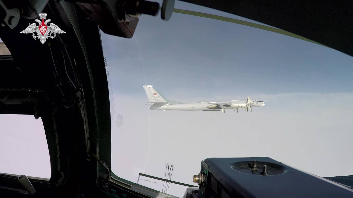 A Tu-95MS armed with Kh-101 cruise missiles, seen from the flight deck of another Tu-95MS, in February 2022. <em>Russian Ministry of Defense</em>