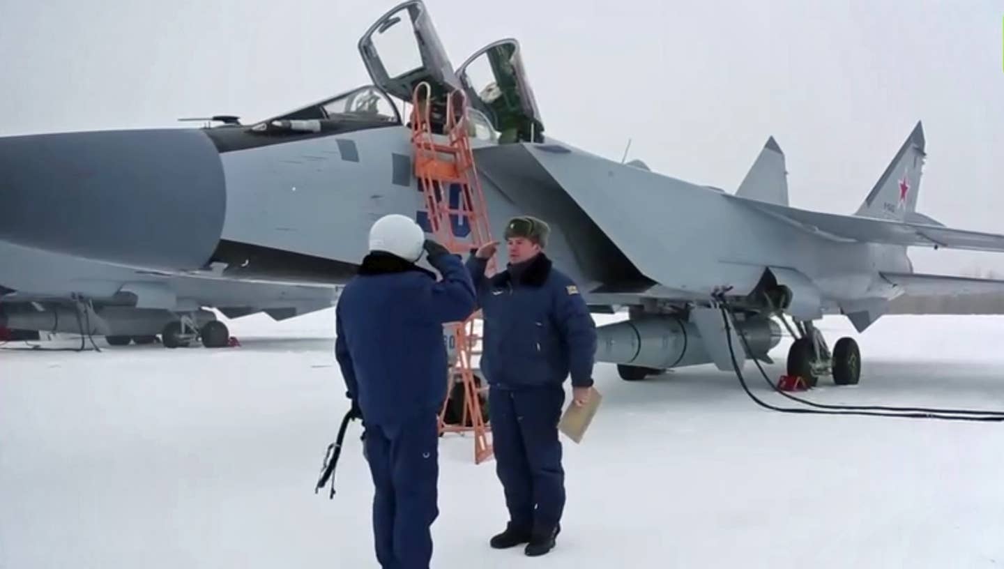 A crewmember prepares for a sortie in a MiG-31K/I armed with a Kinzhal ballistic missile, immediately prior to the Ukraine invasion, on February 19, 2022. <em>Russian Ministry of Defense</em>
