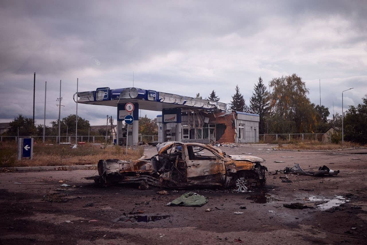 A destroyed vehicle outside a destroyed gas station in Kharkiv Oblast territory recaptured by Ukrainian armed forces. (From the Telegram channel of Ukrainian President Volodymyr Zelensky)