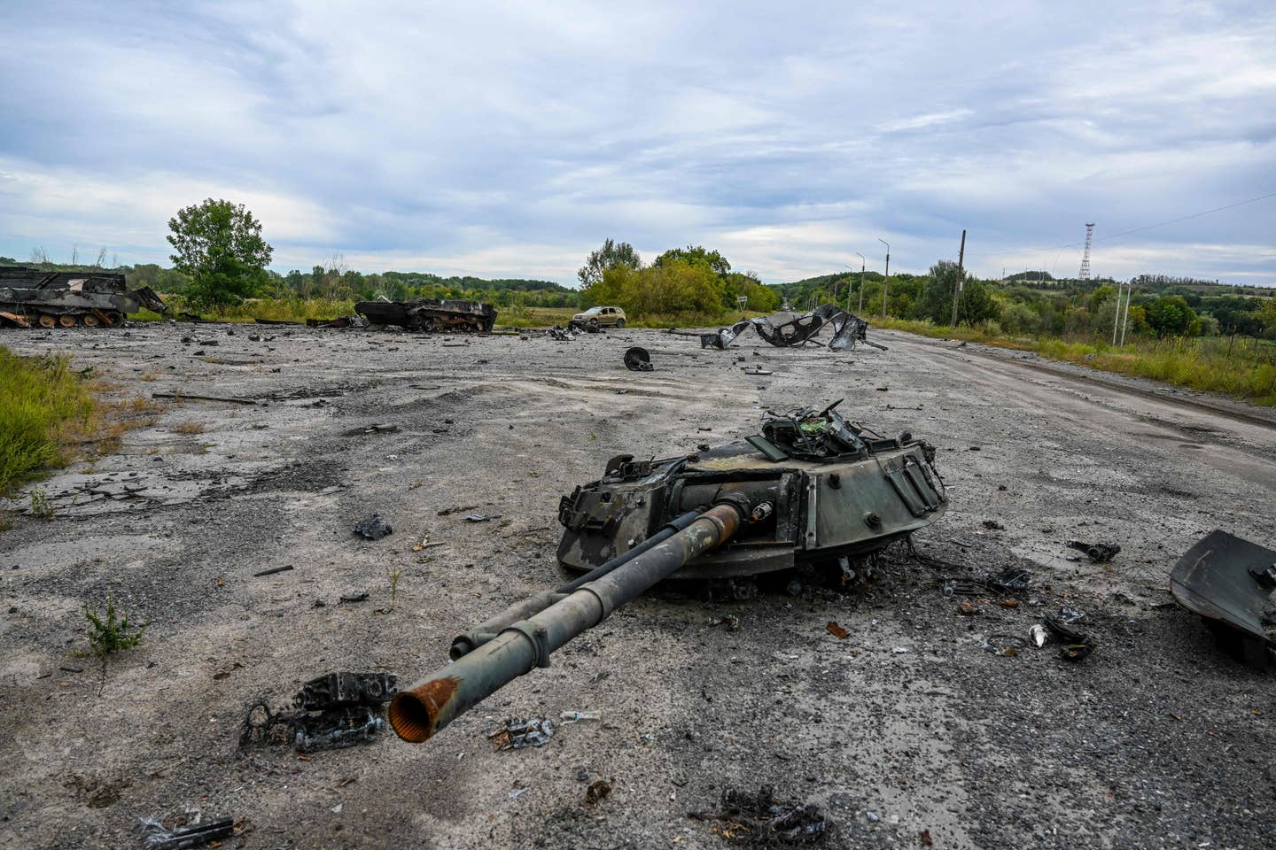 The turret of a Russian tank destroyed during Ukraine's Kharkiv counteroffensive. (Photo by Juan BARRETO / AFP) (Photo by JUAN BARRETO/AFP via Getty Images)
