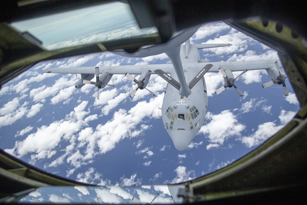 A U.S. Air Force EC-130H Compass Call from the 55th Wing prepares for in-flight refueling from a 155th Air Refueling Wing KC-135 Stratotanker during exercise Emerald Flag over the Gulf of Mexico, Dec. 3, 2020. <em>Credit: U.S. Air Force photo by SSgt Joshua Hoskins</em>