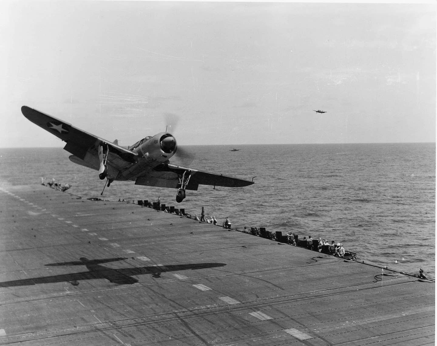 A U.S. Navy SB2C-1 Helldiver of Bombing Squadron 17 (VB-17) takes a wave-off during flight operations aboard the aircraft carrier USS <em>Bunker Hill </em>(CV-17) in the Caribbean, in 1943. <em>USN</em>