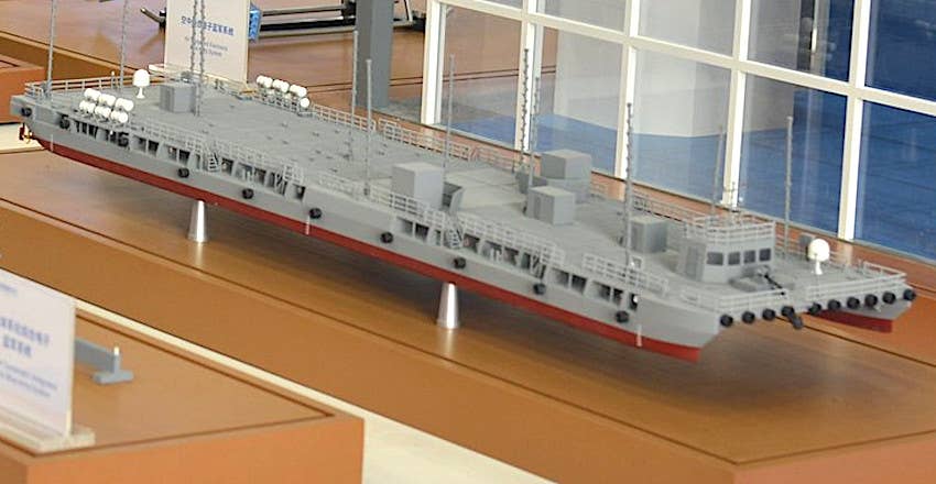 A model of what appears to be the barge in question seen on display at the Zhuhai Airshow in 2021. Visible is the apparent pilothouse, to the right, as well as one of the propellers, at the left. <em>Chinese internet</em>
