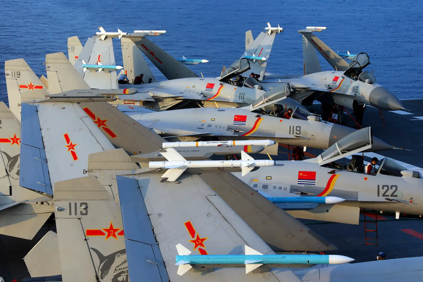 J-15 fighters on the deck of the aircraft carrier&nbsp;<em>Liaoning</em>. The jets are carrying a mix of Chinese-made PL-12 and PL-8 air-to-air missiles, plus air combat maneuvering instrumentation pods.&nbsp;<em>AFP via Getty Images</em>