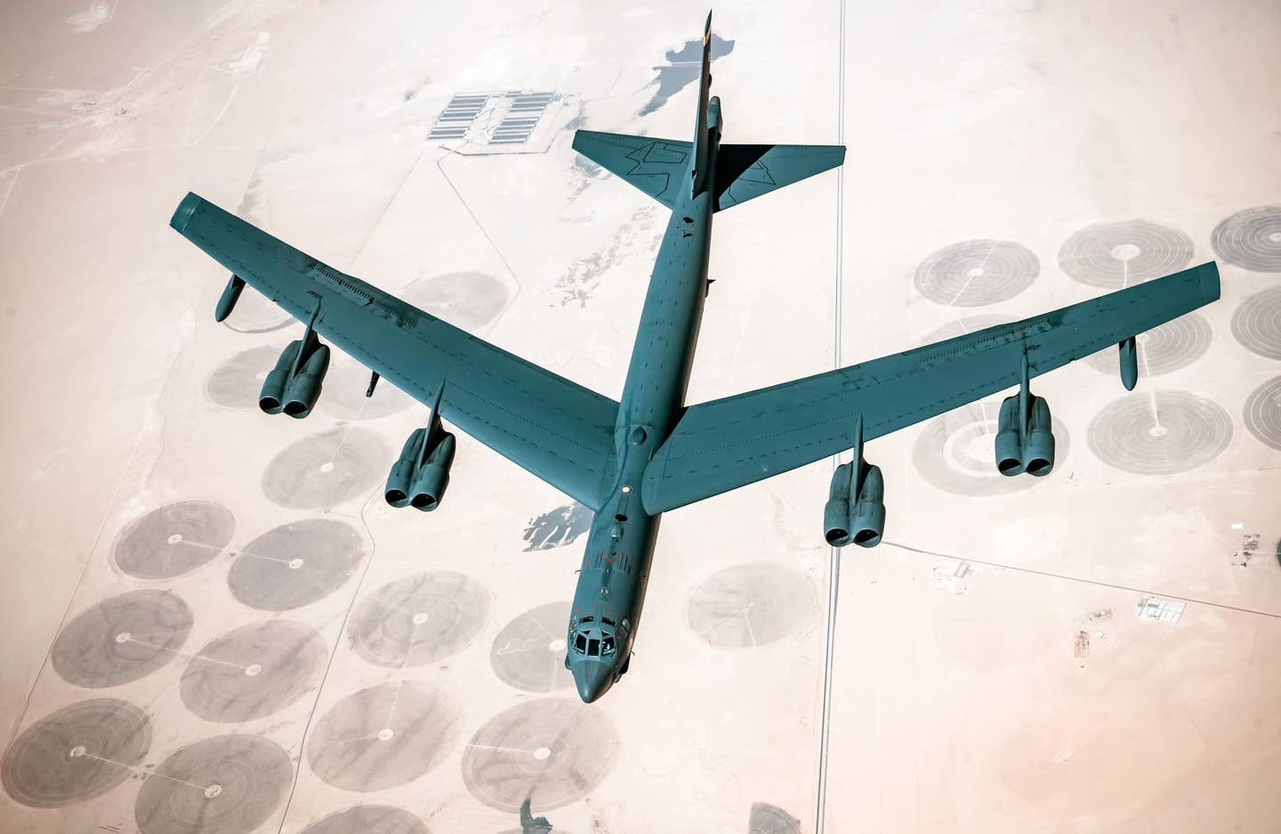 A U.S. Air Force B-52 Stratofortress from the 5th Bomb Wing, Minot Air Force Base, N.D., departs after receiving fuel from a U.S. Air Force KC-135 Stratotanker, its eight nacelles housing TF33 engines can be seen lining the wings. <em>Credit: U.S. Air Force photo by Staff Sgt. Trevor T. McBride</em>