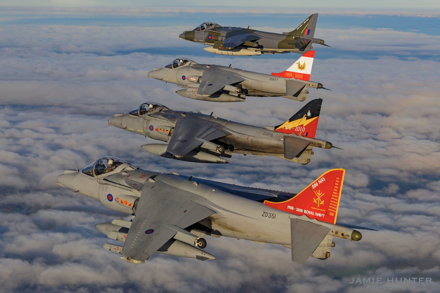 Four specially marked RAF Harrier GR9s fly a photo sortie on December 13, 2010, two days before the United Kingdom retired its last Harriers. <em>Jamie Hunter</em>