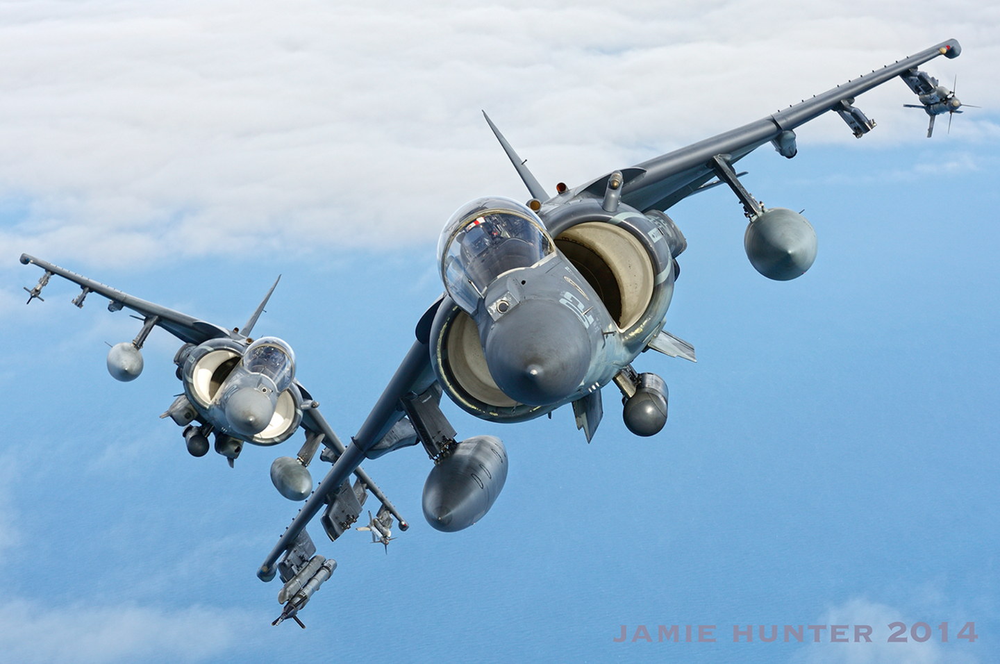 Radar-equipped AV-8B Harrier IIs from Marine Attack Squadron 223 (VMA-223) configured for close-quarters air combat, with Sidewinder missiles and (on the rear aircraft) an Equalizer 25mm gun pod below the fuselage. <em>Jamie Hunter</em>