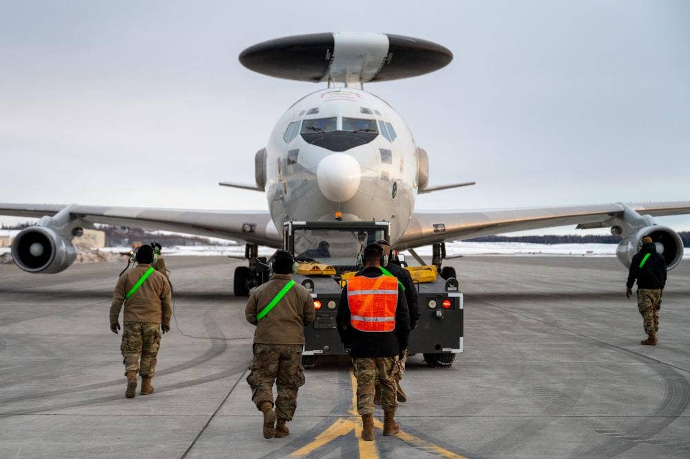 U.S. Airmen assigned to the 962nd Aircraft Maintenance Unit monitor an E-3 Sentry Airborne Warning and Control System as the aircraft is towed at Joint Base Elmendorf-Richardson, Alaska, March 22, 2022. (U.S. Air Force photo by Airman 1st Class Andrew Britten)