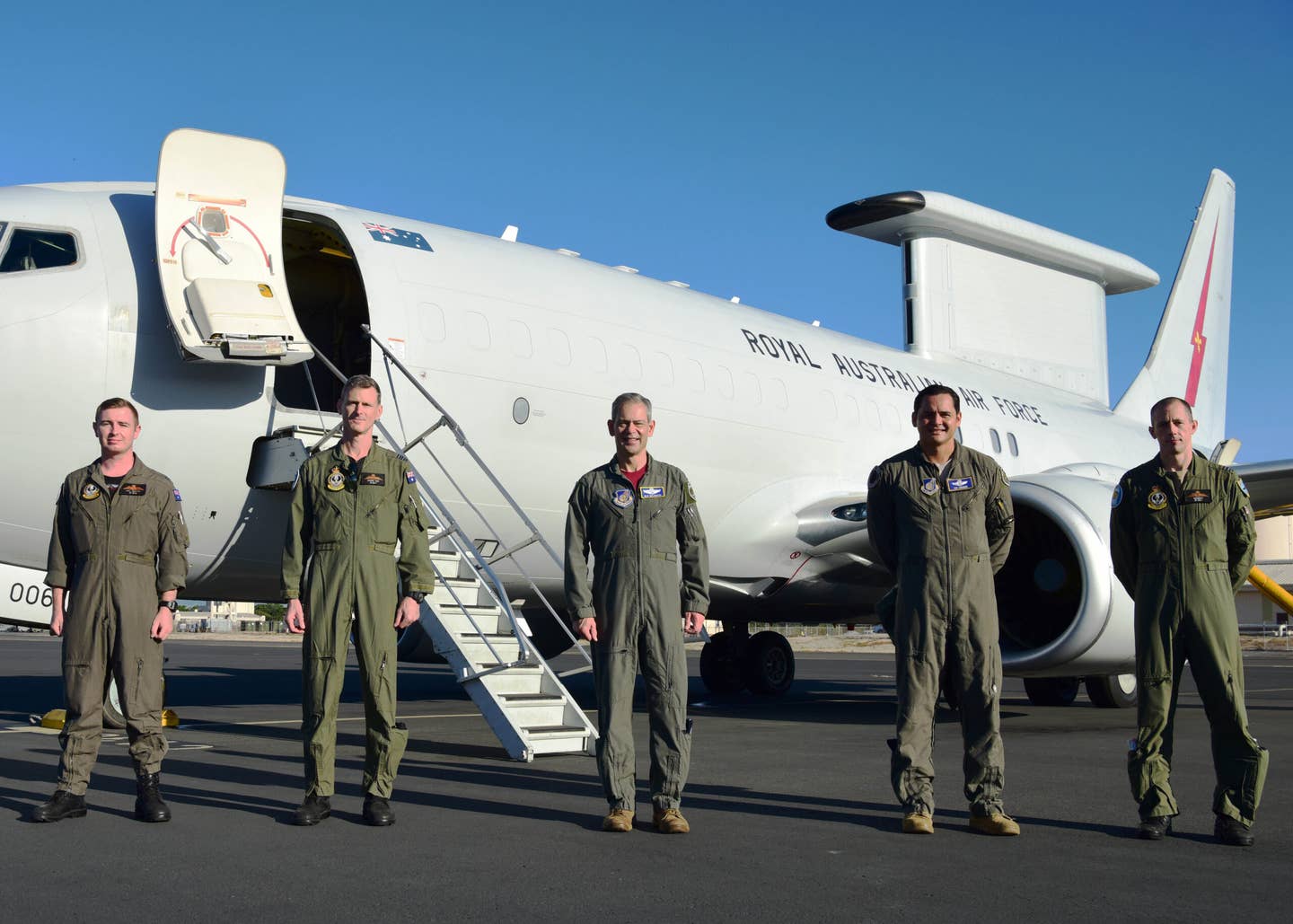 U.S. Air Force Gen. Ken Wilsbach, center, Pacific Air Forces commander, stands with crew members of an Australian E-7 Wedgetail aircraft at Joint Base Pearl Harbor-Hickam, Hawaii, April 16, 2021. The Wedgetail is an airborne early warning and control platform which provides the Australian Military with advanced air battlespace capabilities. (U.S. Air Force photo by Tech. Sgt. Jimmie D. Pike)