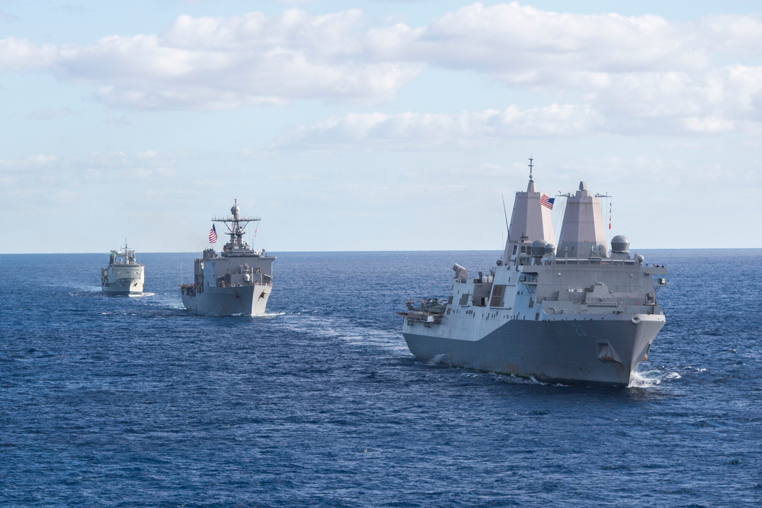 170722-N-YG104-011 CORAL SEA (July 22, 2017) The amphibious transport dock USS Green Bay (LPD 20), the dock landing ship USS Ashland (LSD 48) and a Royal Australian Navy replenishment oiler HMAS Success (OR 304) steam along with a Combined Amphibious Force during a mutli-ship sailing formation during Talisman Saber 17. Talisman Saber is a biennial U.S. bilateral exercise held off the coast of Australia meant to achieve interoperability and strengthen the U.S.-Australia alliance. (U.S. Navy photo by Mass Communication Specialist 2nd Class Sarah Villegas/Released)