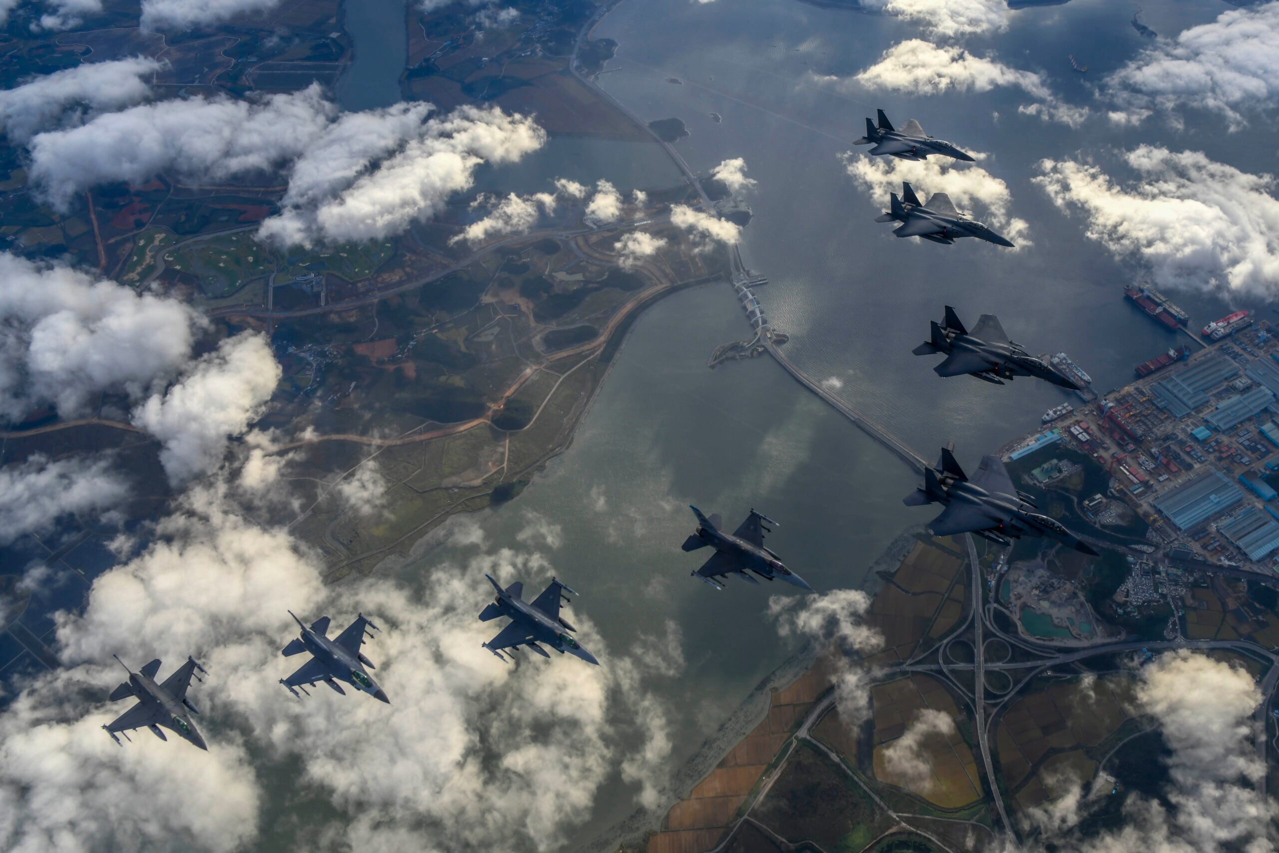 UNDISCLOSED LOCATION - OCTOBER 04: In this handout image released by the South Korean Defense Ministry, South Korean Air Force F-15Ks and U.S. Air Force F-16 fighter jets fly over the Korean Peninsula in response to North Korea's intermediate-range ballistic missile (IRBM) launch earlier in the day, on October 04, 2022 at an undisclosed location.North Korea fired an intermediate-range ballistic missile (IRBM) over Japan on Tuesday in its first launch of an IRBM in eight months, according to South Korea’s military. (Photo by South Korean Defense Ministry via Getty Images)