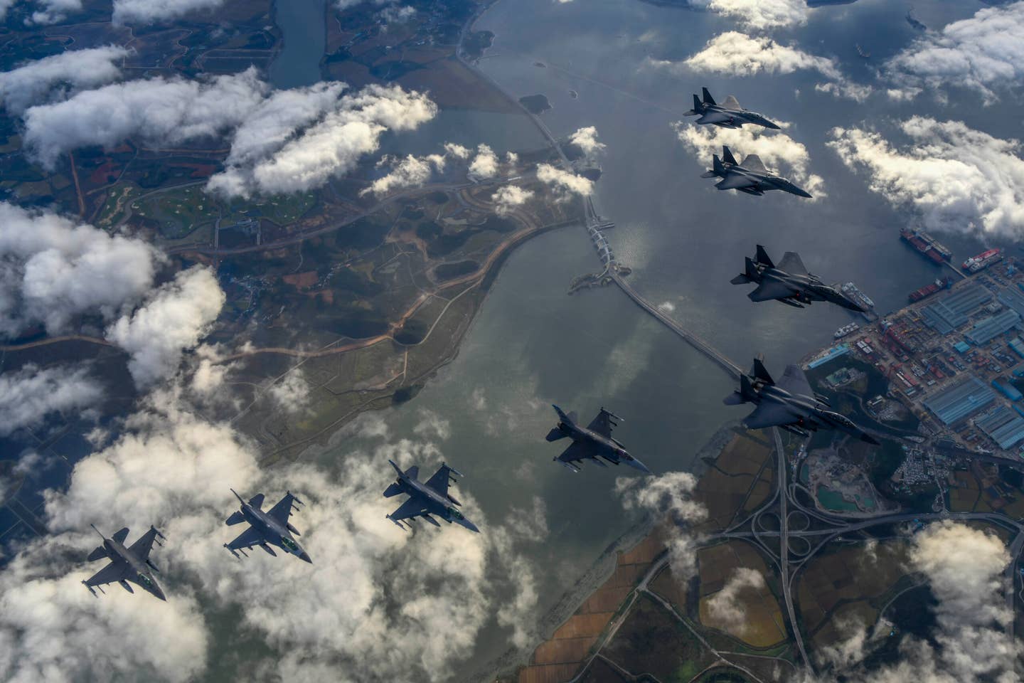 ROKAF F-15Ks and U.S. Air Force F-16 fighter jets fly over the Korean peninsula in response to the North Korean IRBM launch on October 4, 2022. <em>Photo by South Korean Defense Ministry via Getty Images</em>