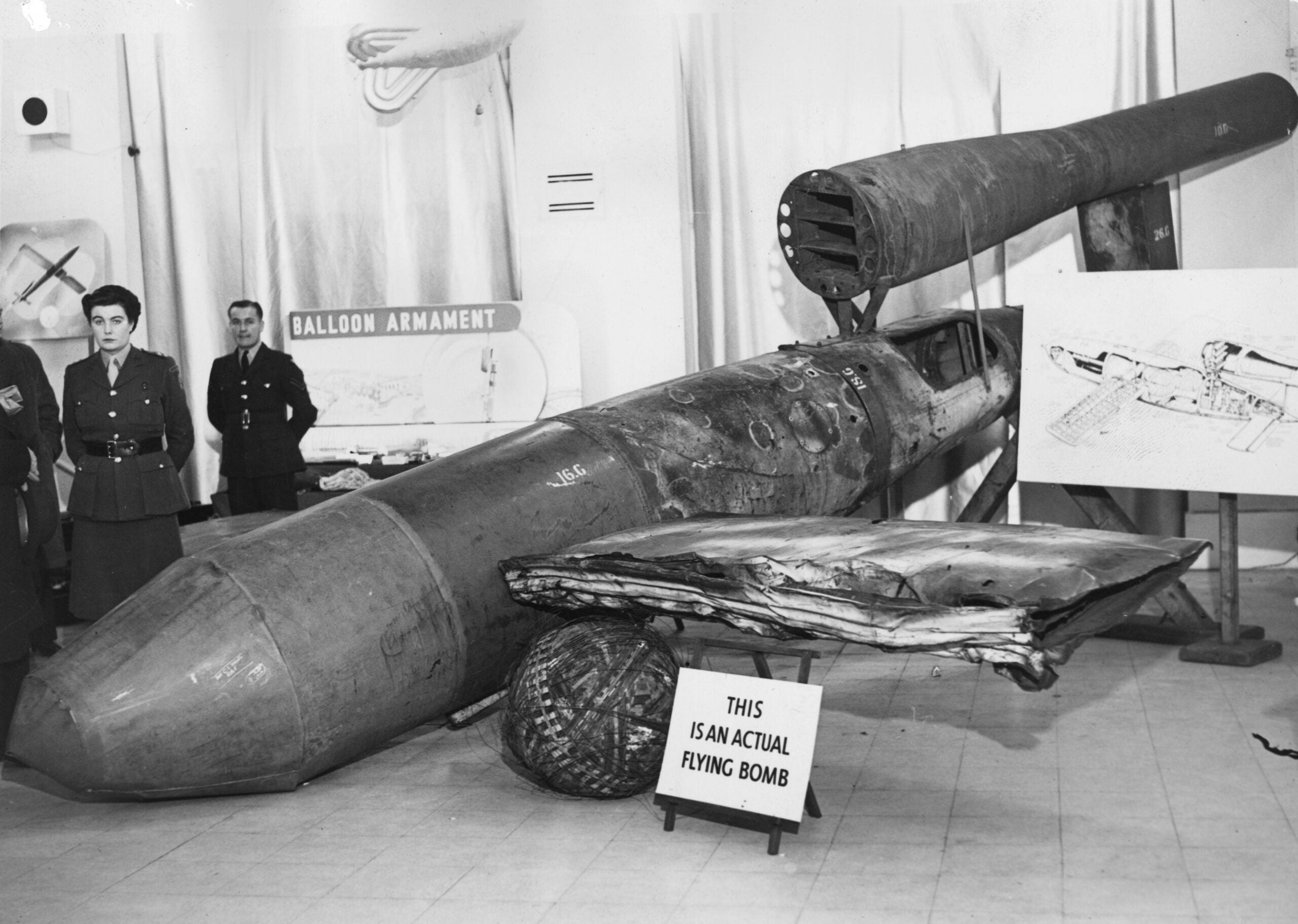 1st November 1944:  A V1 flying bomb, or Doodlebug, on show at Roote's, Piccadilly, London. A sign next to the bomb reads 'This is an actual flying bomb'.  (Photo by A. R. Coster/Topical Press Agency/Getty Images)