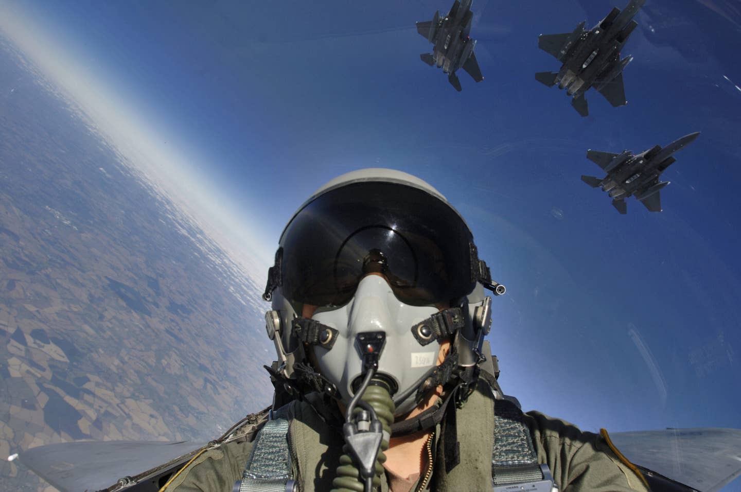A division of F-15Es is seen from the cockpit.  (U.S. Air Force photo Master Sgt. Lance Cheung)