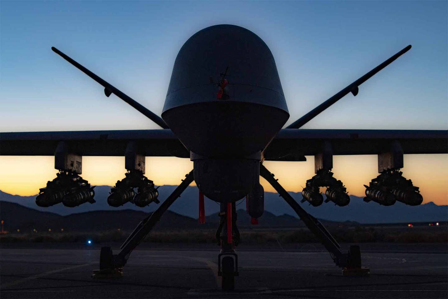 An MQ-9A Reaper assigned to the 556th Test and Evaluation Squadron armed with eight Hellfire missiles for the first time. (U.S. Air Force-SrA Haley Stevens).<br>