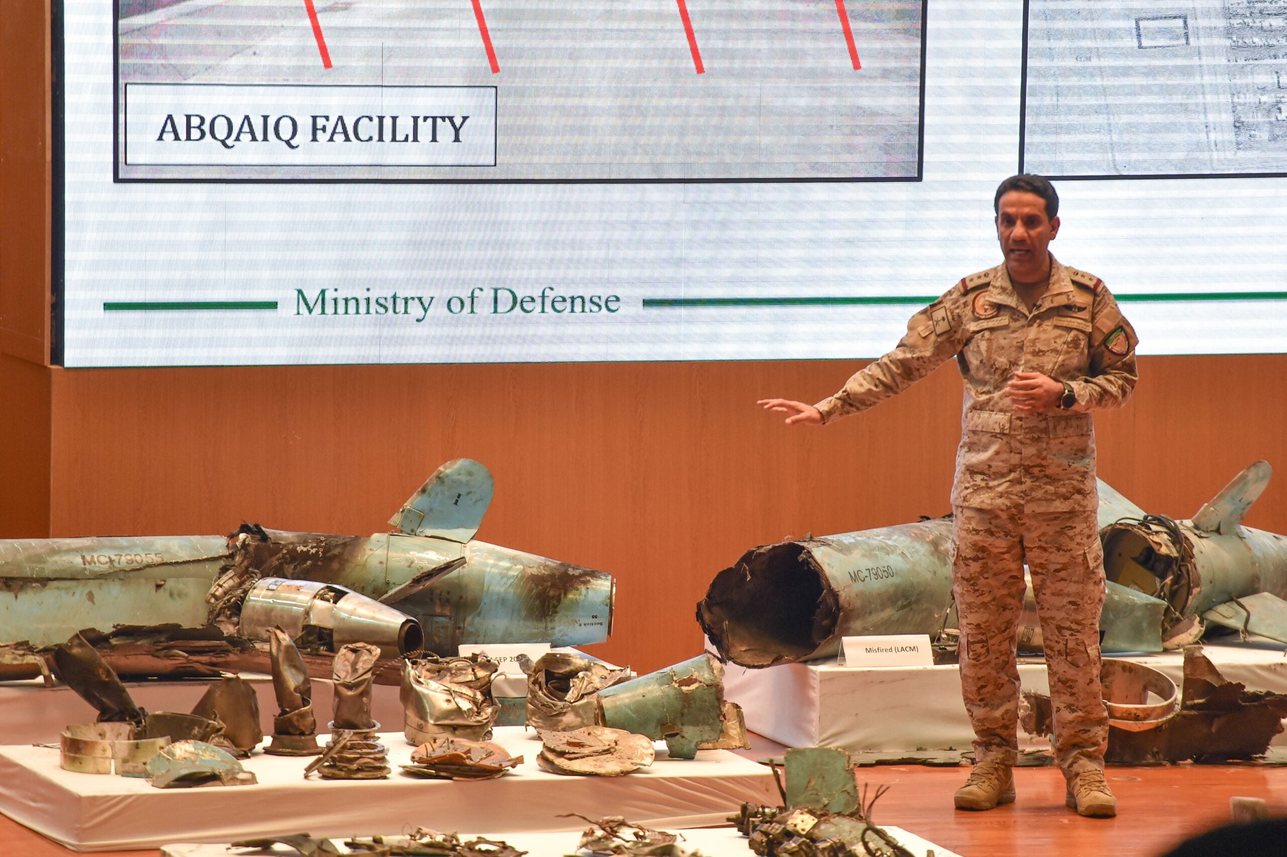 TOPSHOT - Saudi defence ministry spokesman Colonel Turki bin Saleh al-Malki displays pieces of what he said were Iranian cruise missiles and drones recovered from the attack site that targeted Saudi Aramco's facilities, during a press conference in Riyadh on September 18, 2019. - Saudi Arabia said that strikes on its oil infrastructure came from the "north" and were sponsored by Iran, but that the kingdom was still investigating the exact launch site. (Photo by Fayez Nureldine / AFP) (Photo by FAYEZ NURELDINE/AFP via Getty Images)