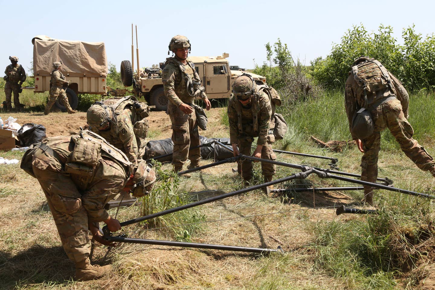 U.S. soldiers disassemble a TOC during exercise Allied Spirit at Drawsko Pomorskie Training Area, Poland, June 13, 2020. <em>U.S. Army photo by Sgt. Julian Padua</em>