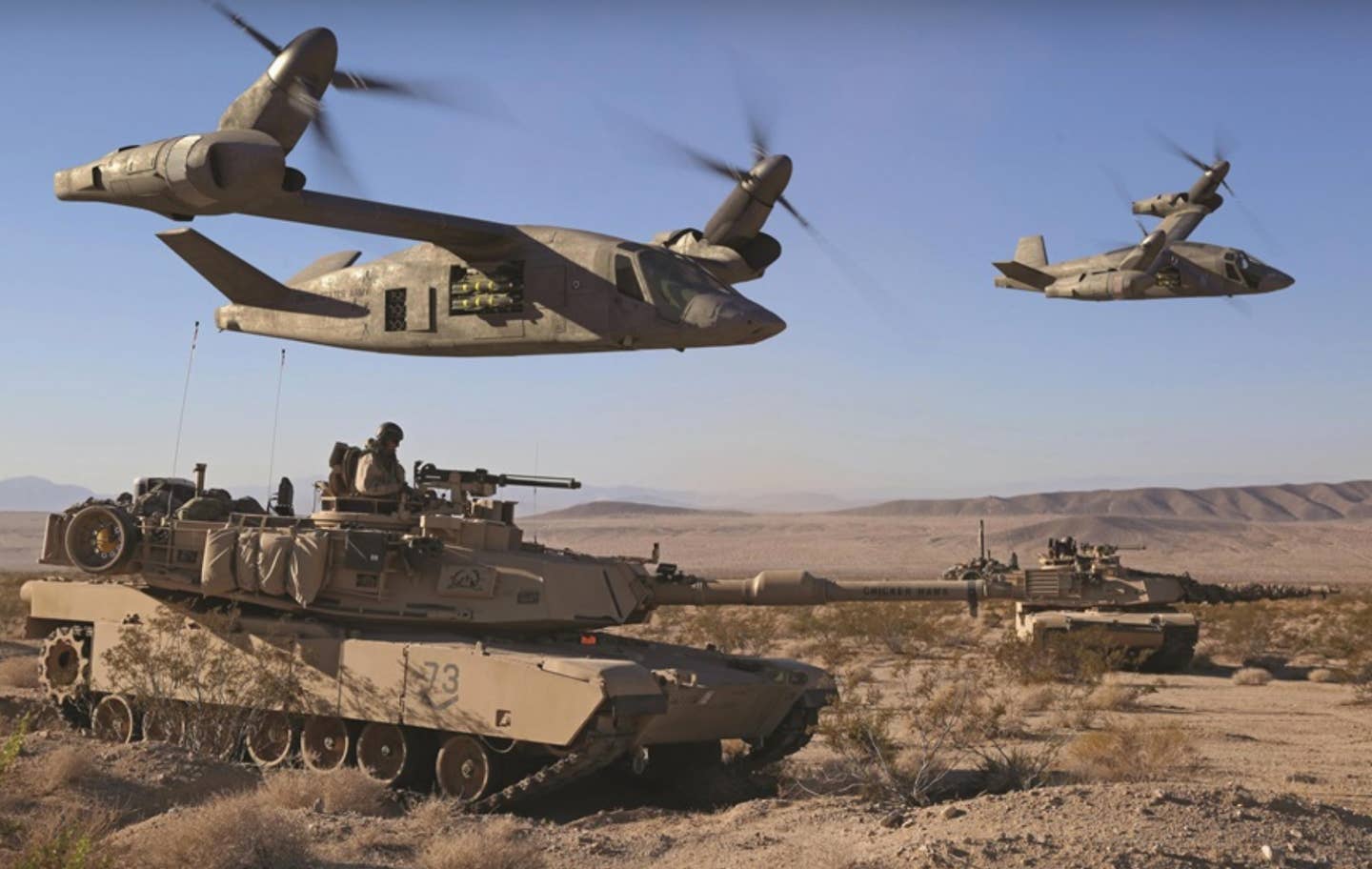 Bell's V-280 Valor, seen here in attack configuration supporting Abrams tanks, are in the running for FLRAA. <em>Bell image</em>