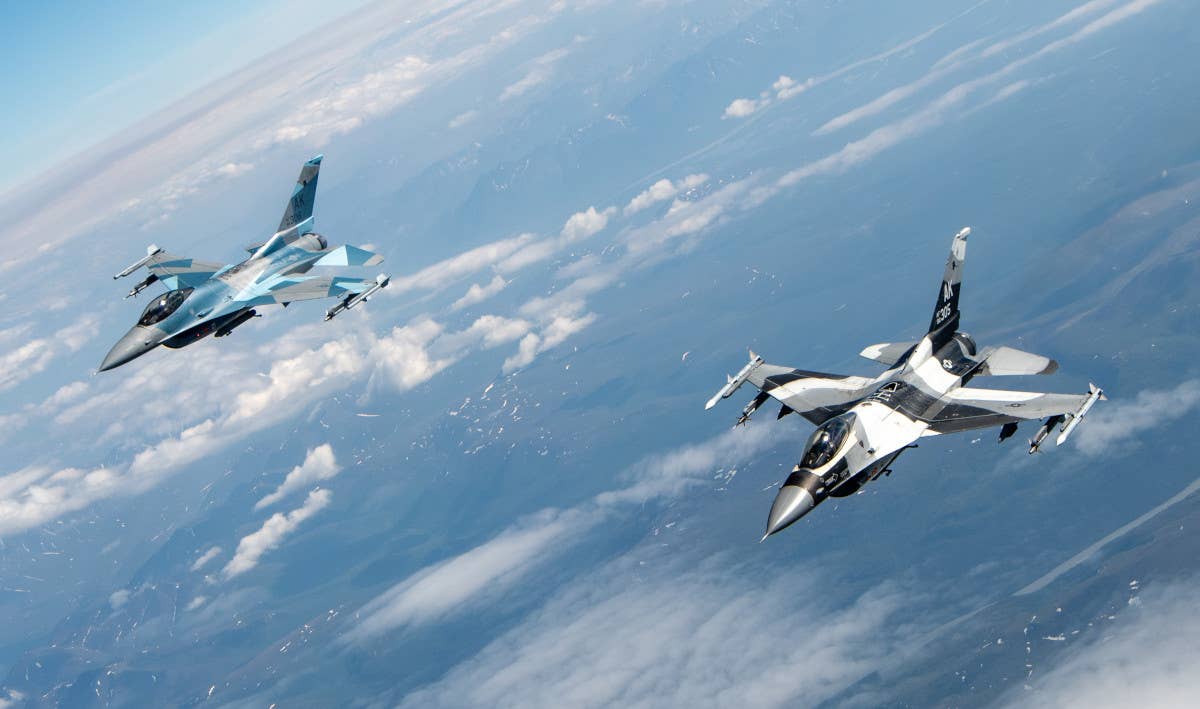 Two of the 18th Aggressor Squadron's F-16Cs fly side-by-side during Exercise Red Flag-Alaska 22-2. <em>USAF</em>