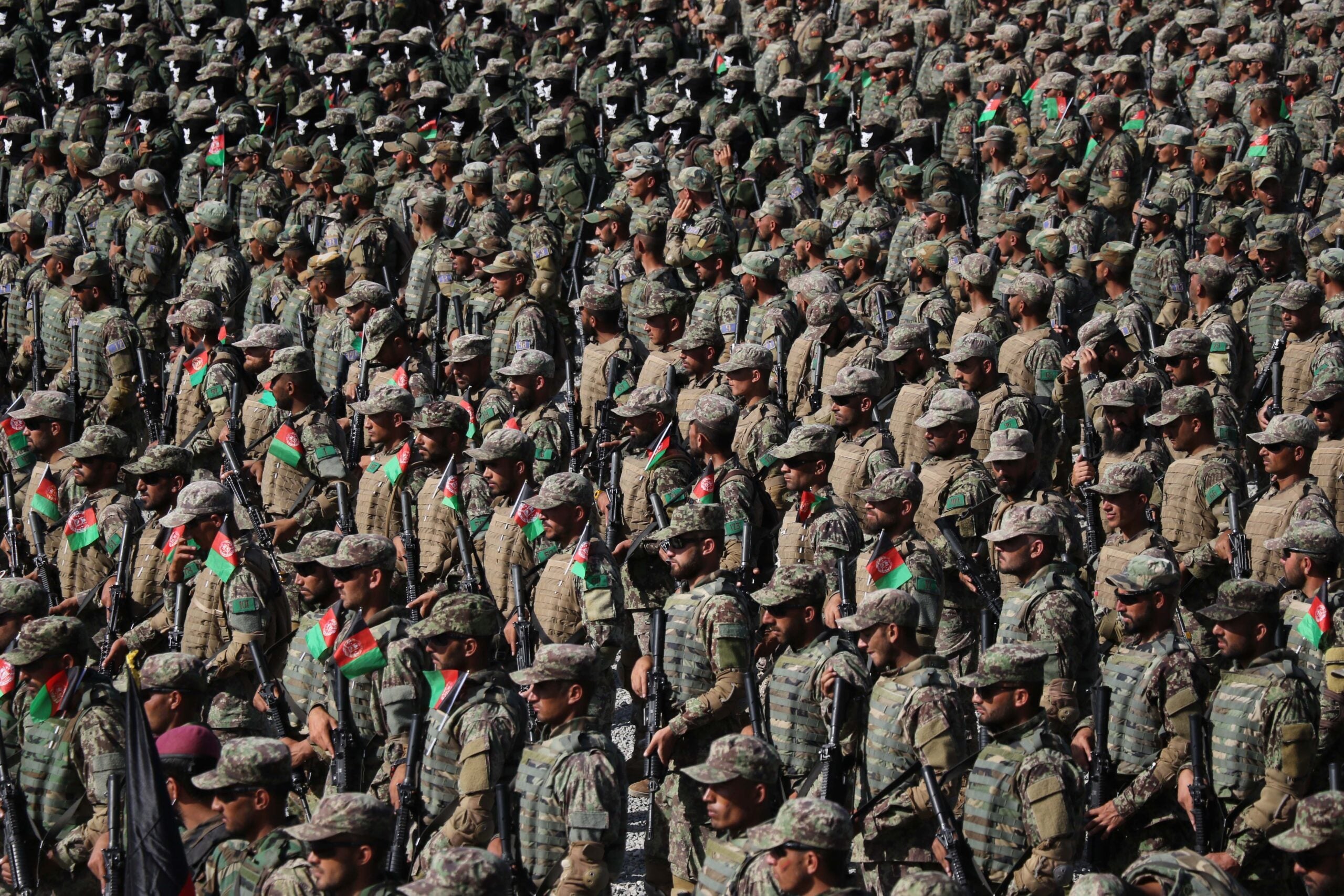 KABUL, AFGHANISTAN-MAY 31: Afghan special force commando unit officers and soldiers attend a graduation ceremony at the military academy in Kabul, Afghanistan, on May 31, 2021. At least hundreds Afghan special force commando officers and soldiers including women were graduated. According to the reports, the Taliban have significantly increased violence immediately across the Afghanistan after the US, and NATO forces began the last phase of their pull out of the country on 01 May. (Photo by Haroon Sabawoon/Anadolu Agency via Getty Images)