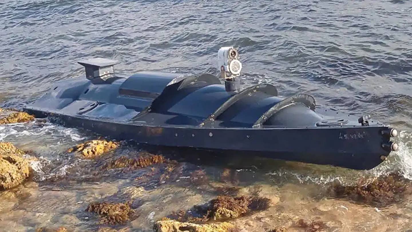 The mysterious unmanned surface vessel that washed ashore in Crimea in early September. At the time, <em>The War Zone's </em>analysis stated the very low profile jet-ski engine-powerd unmanned boat was a weaponized 'suicide drone' setup for impact detonation.