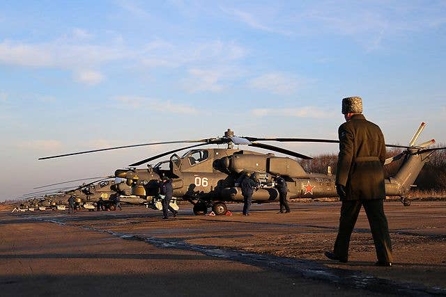 A line-up of Mi-28Ns at Ostrov Air Base in 2016. <em>Ostrow1341/Wikimedia Commons</em>