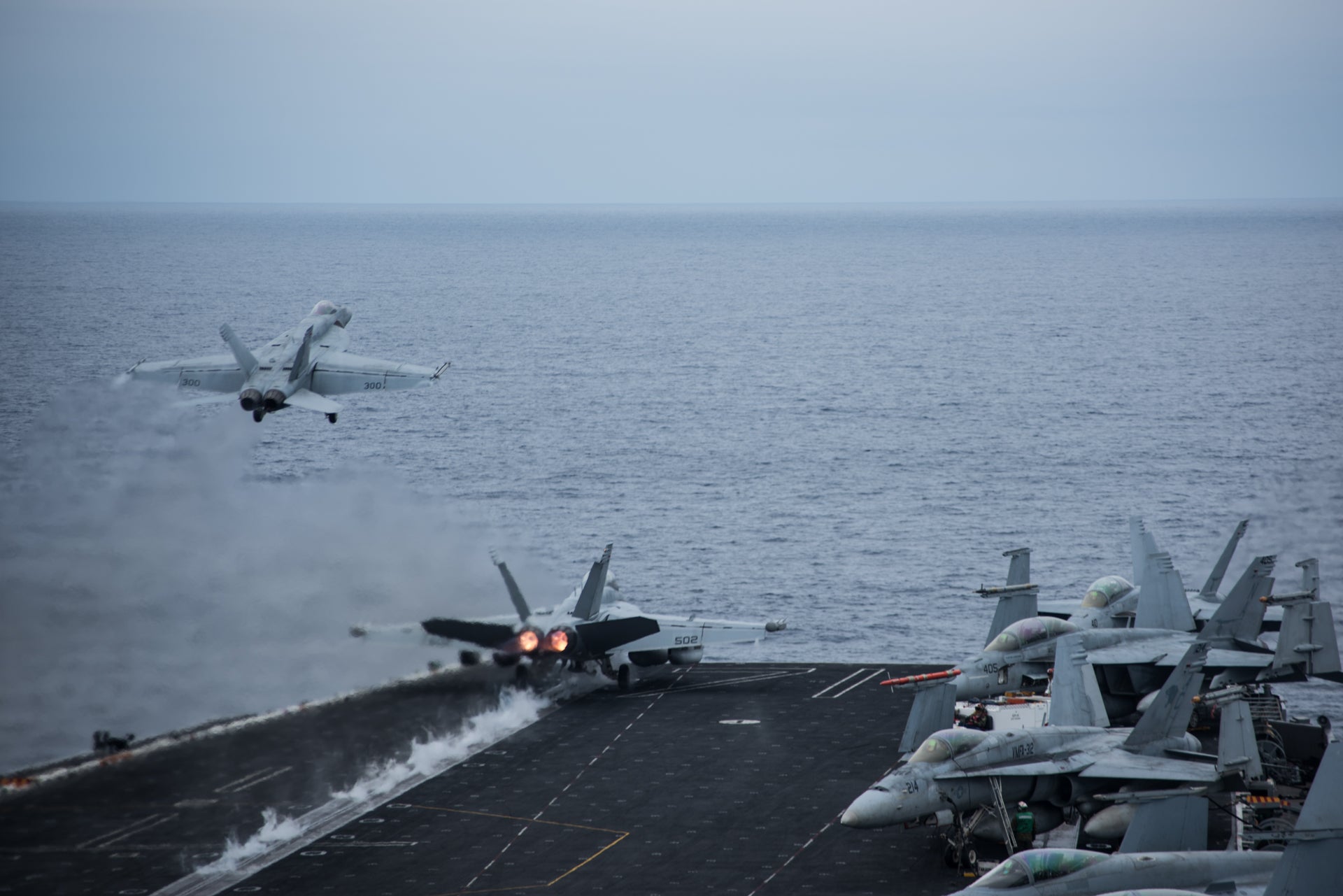 170819-N-FP690-142 
PACIFIC OCEAN (Aug. 19, 2017) Two F/A-18 Super Hornets take off from the flight deck of the aircraft carrier USS Theodore Roosevelt (CVN 71). Theodore Roosevelt is underway conducting a composite training unit exercise (COMPTUEX) with its carrier strike group in preparation for an upcoming deployment. COMPTUEX tests a carrier strike group's mission readiness and ability to perform as an integrated unit through simulated real-world scenarios. (U.S. Navy photo by Mass Communication Specialist 3rd Class Robyn B. Melvin/Released)
