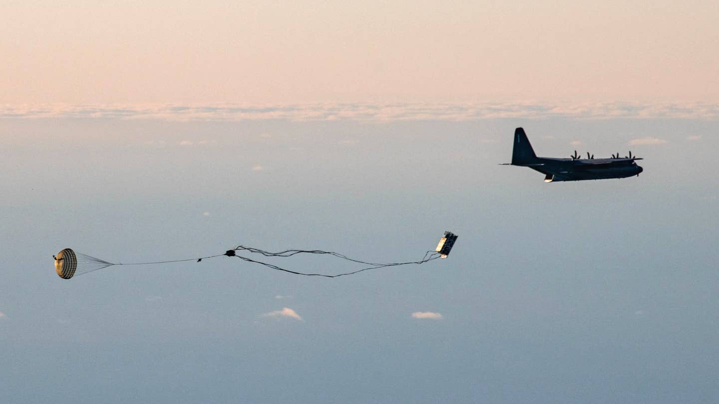An MC-130J Commando II from the 352nd Special Operations Wing releases a Rapid Dragon palletized munitions system during a demonstration off the coast of Norway. <em>Oklahoma Air National Guard</em>