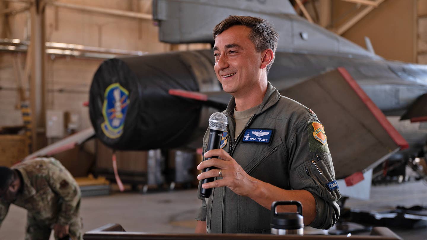 Maj. Lance Tucker, 309th Fighter Squadron commander, gives a speech at Luke Air Force Base, Arizona, on September 7, 2022. The 309th FS held a jet-signing event to commemorate the last of the oldest F-16s retiring from the 56th Fighter Wing to the 309th AMARG at Davis-Monthan Air Force Base, Arizona. <em>U.S. Air Force photo by Airman Mason Hargrove</em>