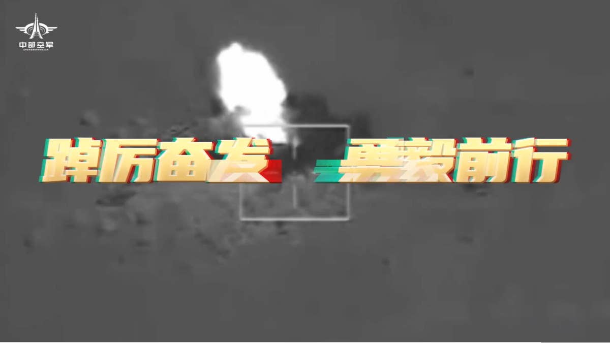 A screengrab from a clip showing a munition impacting a training or testing range, which appears to have been taken with an infrared sensor system. This immediately follows the clip of the large bomb being dropped in the recently released PLA Central Theater Command video montage. <em>PLA capture</em>