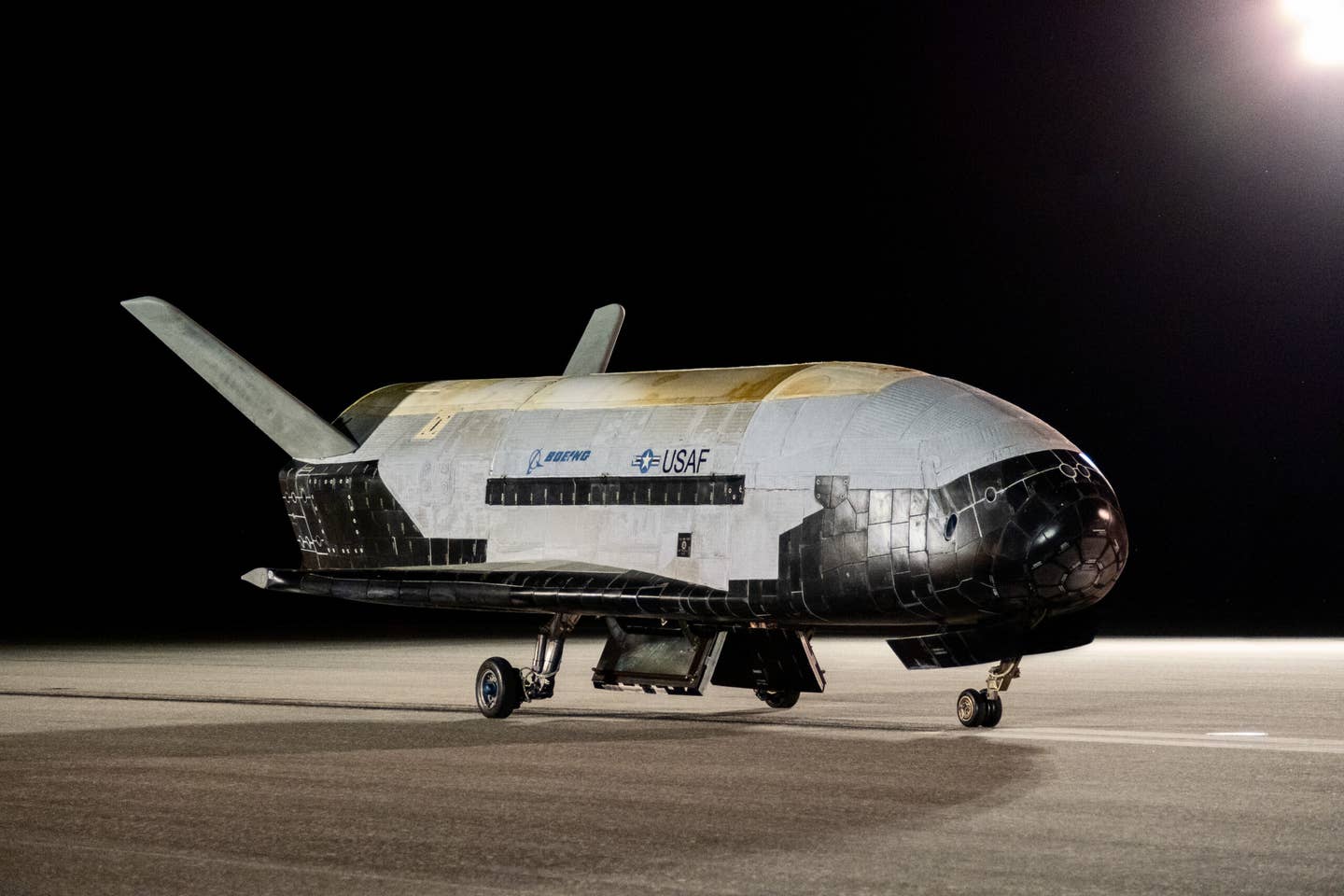 The X-37B Orbital Test Vehicle-6 rests on the flight line at NASA’s Kennedy Space Center, Florida, on November 12, 2022, after it concluded its sixth successful mission that lasted 908 days. <em>U.S. Air Force photo by Staff Sgt. Adam Shank</em>