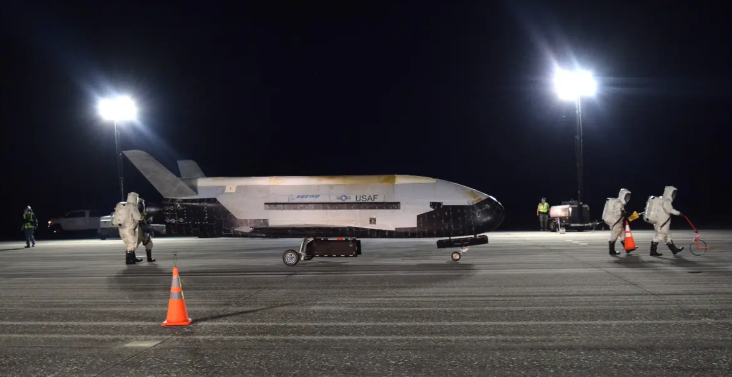 U.S. Air Force personnel examine the X-37B after it landed following the completion of OTV-5 in 2019.&nbsp;<em>USAF</em>