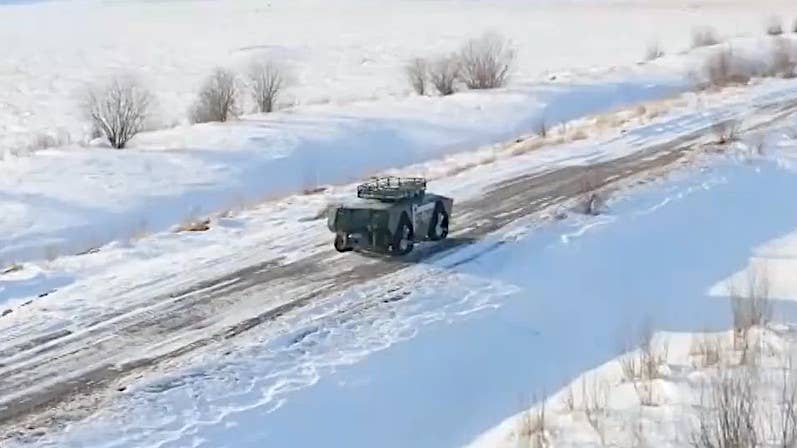 A screen shot from CSGC's promotional montage showing the amphibious uncrewed ground vehicle operating on land in snowy conditions. <em>Screen capture via Twitter/Chinese Internet</em>