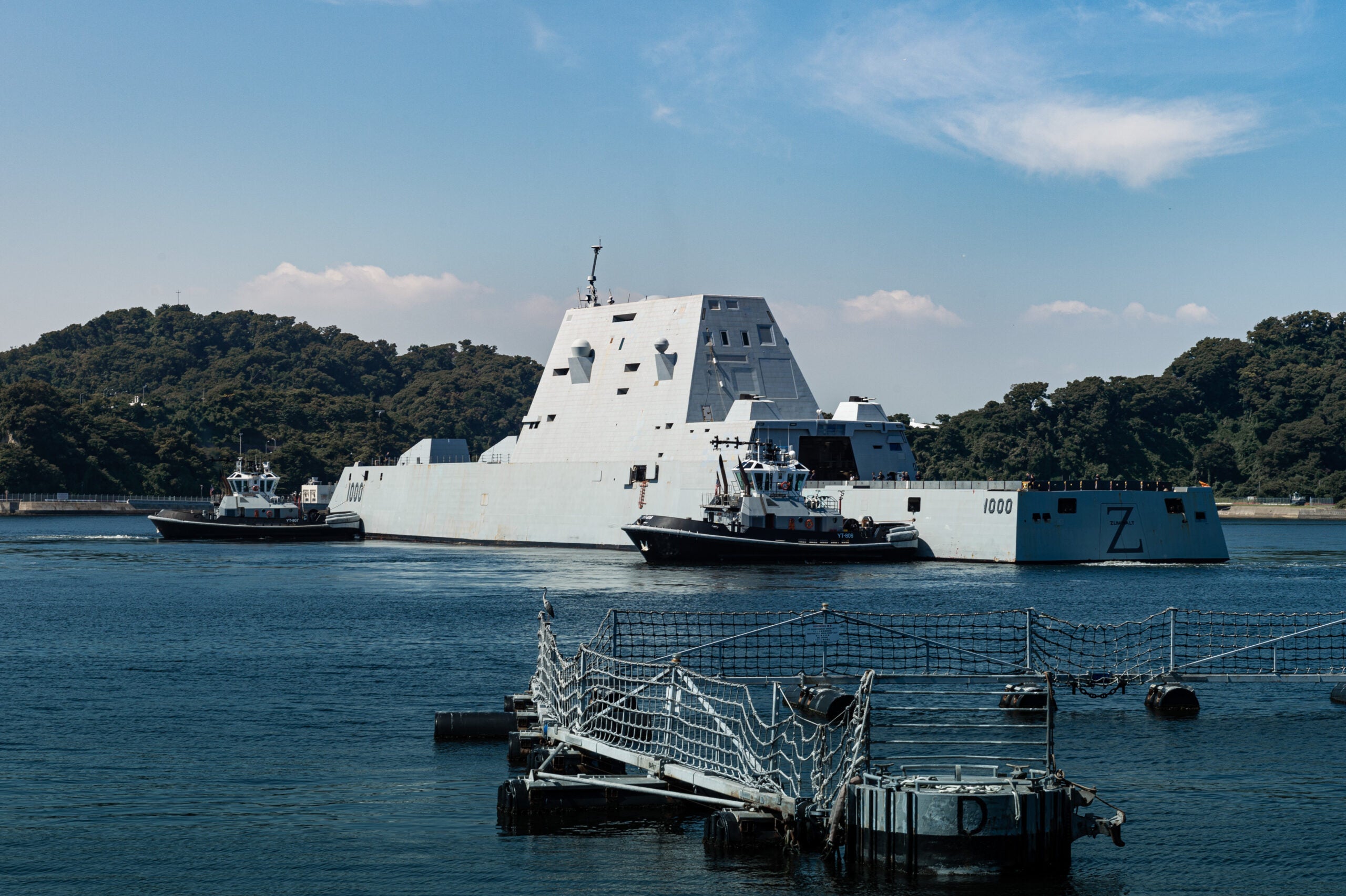 YOKOSUKA, Japan (Sept. 26, 2022) The Valiant-class harbor tugs Puyallup (YT-806) and Menominee (YT-807), assigned to Commander, Fleet Activities Yokosuka (CFAY), escort the Zumwalt-class guided-missile destroyer USS Zumwalt (DDG 1000) to a berth at CFAY for a scheduled port visit. For more than 75 years, CFAY has provided, maintained, and operated base facilities and services in support of the U.S. 7th Fleet's forward deployed naval forces, tenant commands, and thousands of military and civilian personnel and their families. (U.S Navy photo by Seaman Darren Cordoviz)