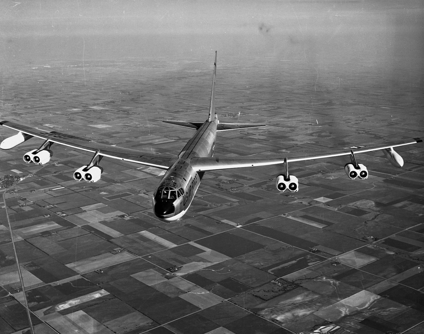 During a photo flight in 1958, a Boeing B-52 Stratofortress bomber flies over the farmland of the midwestern United States. | Location: Midwestern United States. (Photo by © Museum of Flight/CORBIS/Corbis via Getty Images)