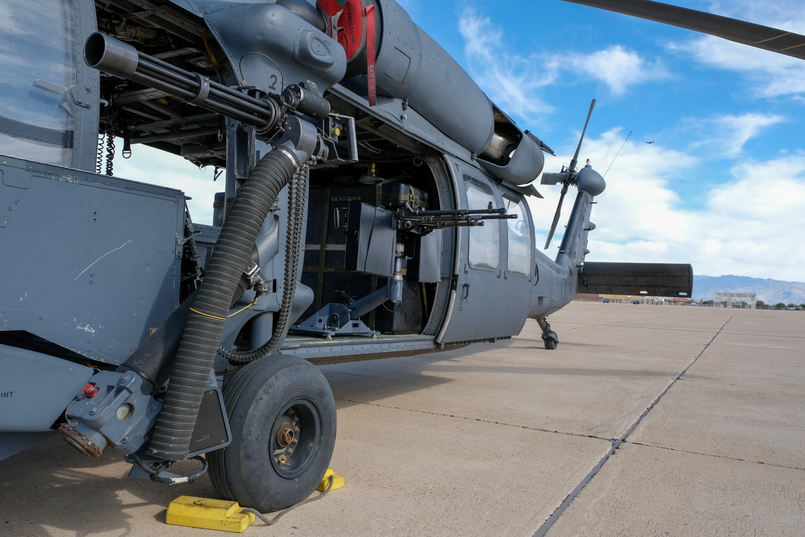 Two M240s are mounted inside an HH-60G Pave Hawk helicopter Nov. 22, 2022, at Davis-Monthan Air Force Base, Arizona. The 943d RQG designed a concept to mount four additional M240 machine guns into HH-60G helicopters to provide more firepower to the 920th Rescue Wing’s personnel recovery task force in contested environments. (U.S. Air Force photo by Andre Trinidad)