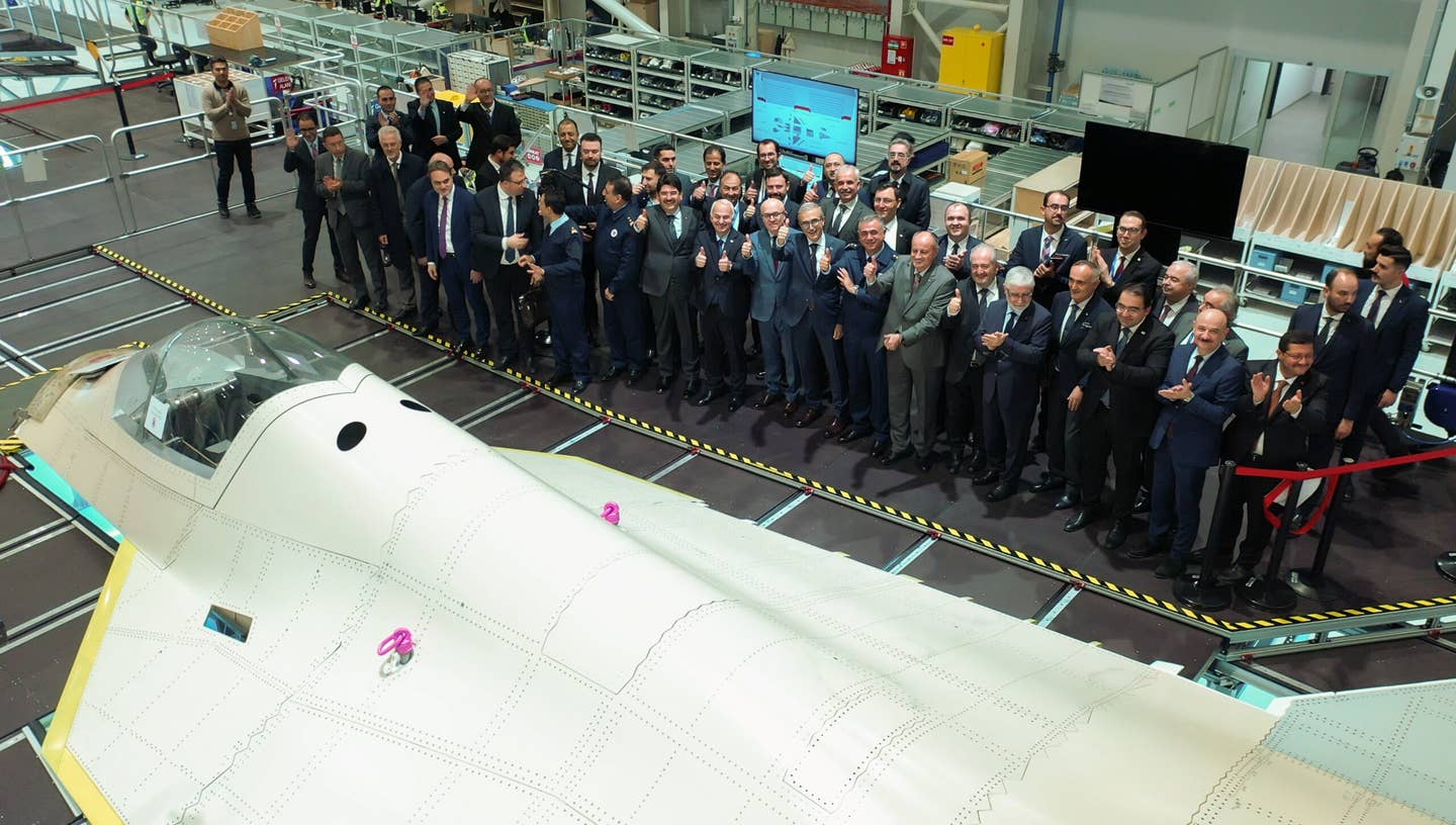 Officers from the Ministry of National Defense, Turkiye Defense of Industry Agency, and the Air Forces Command during an opening ceremony of the TF-X assembly line at Turkish Aerospace Industries Inc. in Ankara on November 21, 2022. <em>Turkish Aerospace Industries/Handout/Anadolu Agency via Getty Images</em>