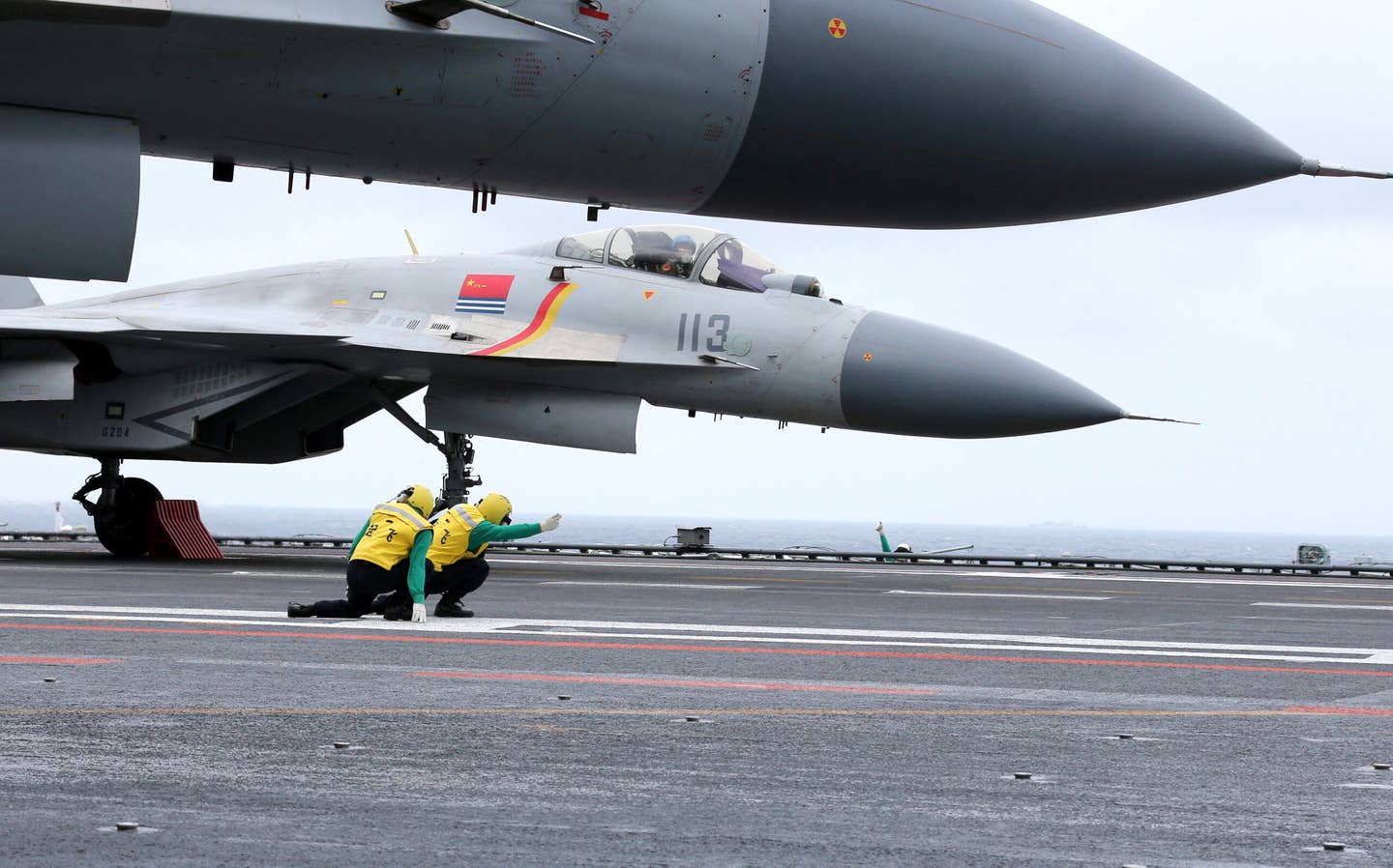 A J-15 prepares to launch off the deck of the aircraft carrier <em>Liaoning</em> during military drills in the South China Sea. <em>STR/AFP via Getty Images</em>