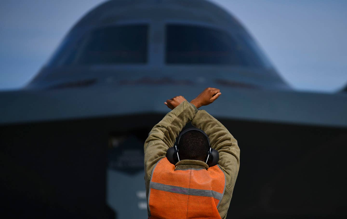 A crew chief from the 509th Maintenance group lines up eight B-2s for the elephant walk. <em>U.S. Air Force photo by Tech. Sgt. Heather Salazar</em>