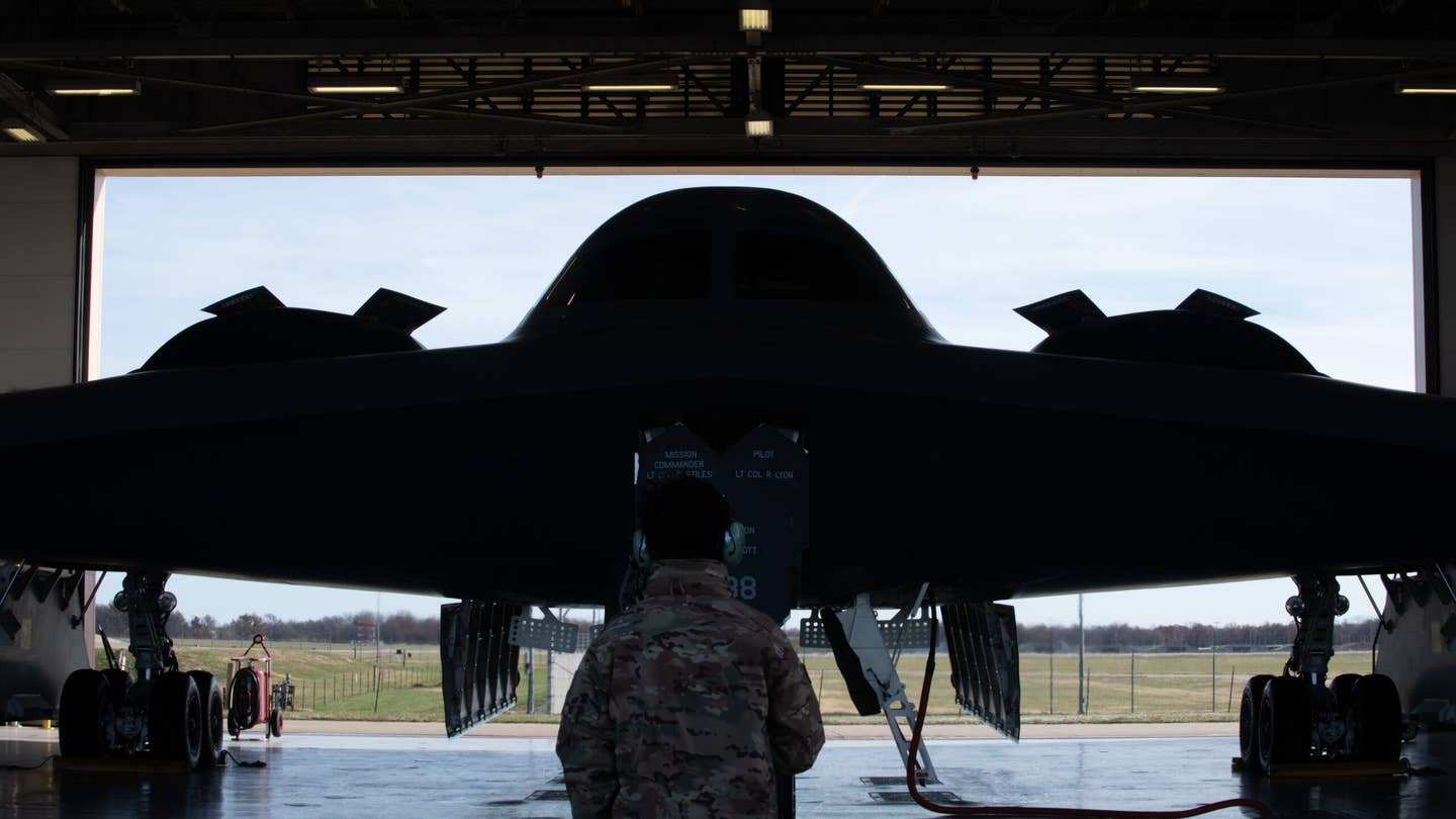 A 509th Bomb Wing maintainer prepares a B-2 for takeoff. <em>U.S. Air National Guard photo by Airman 1st Class Phoenix Lietch</em>
