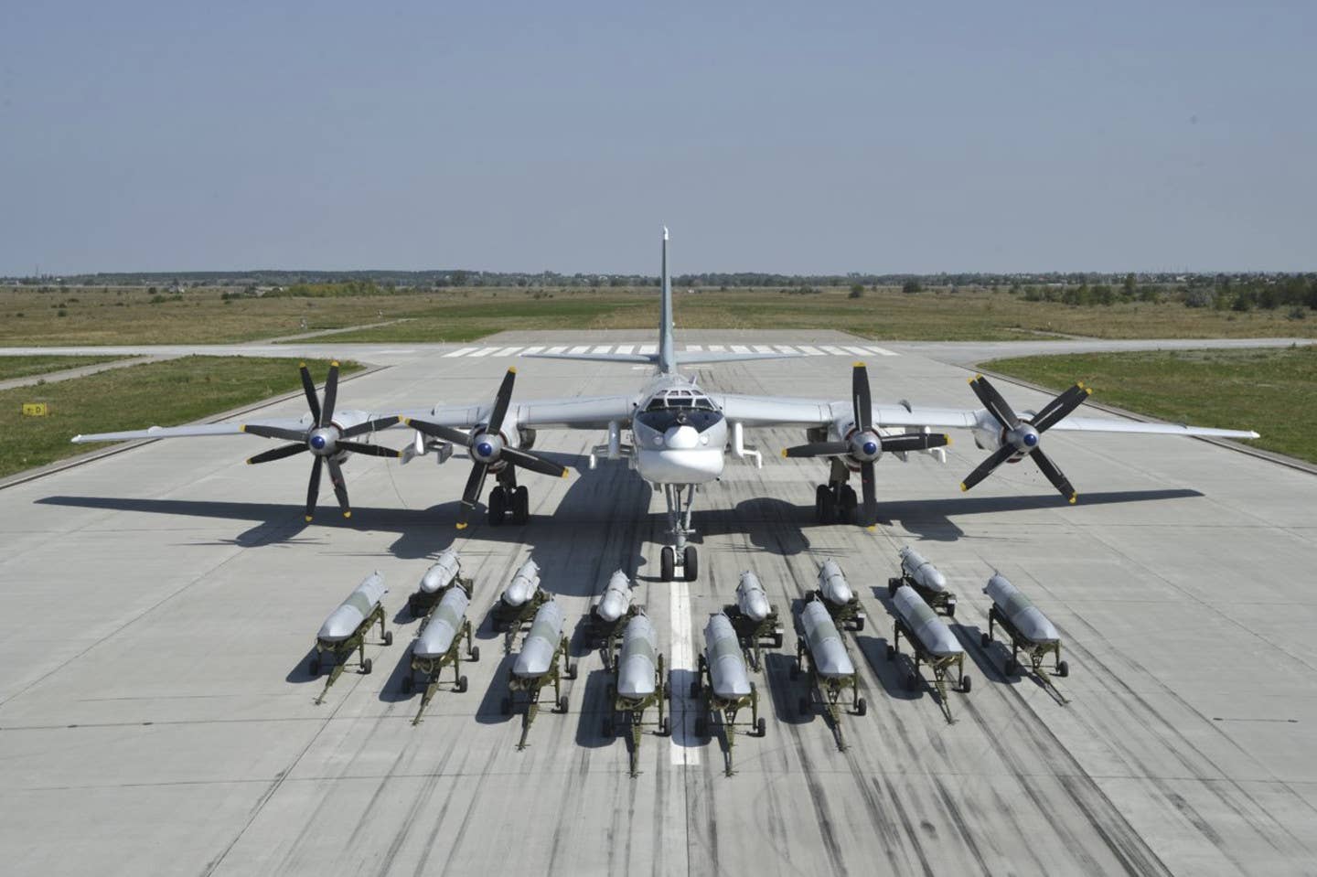 Kh-55 and Kh-101/102 series cruise missiles are seen here displayed in front of a Tu-95MS bomber. <em>Russian Ministry of Defense</em>