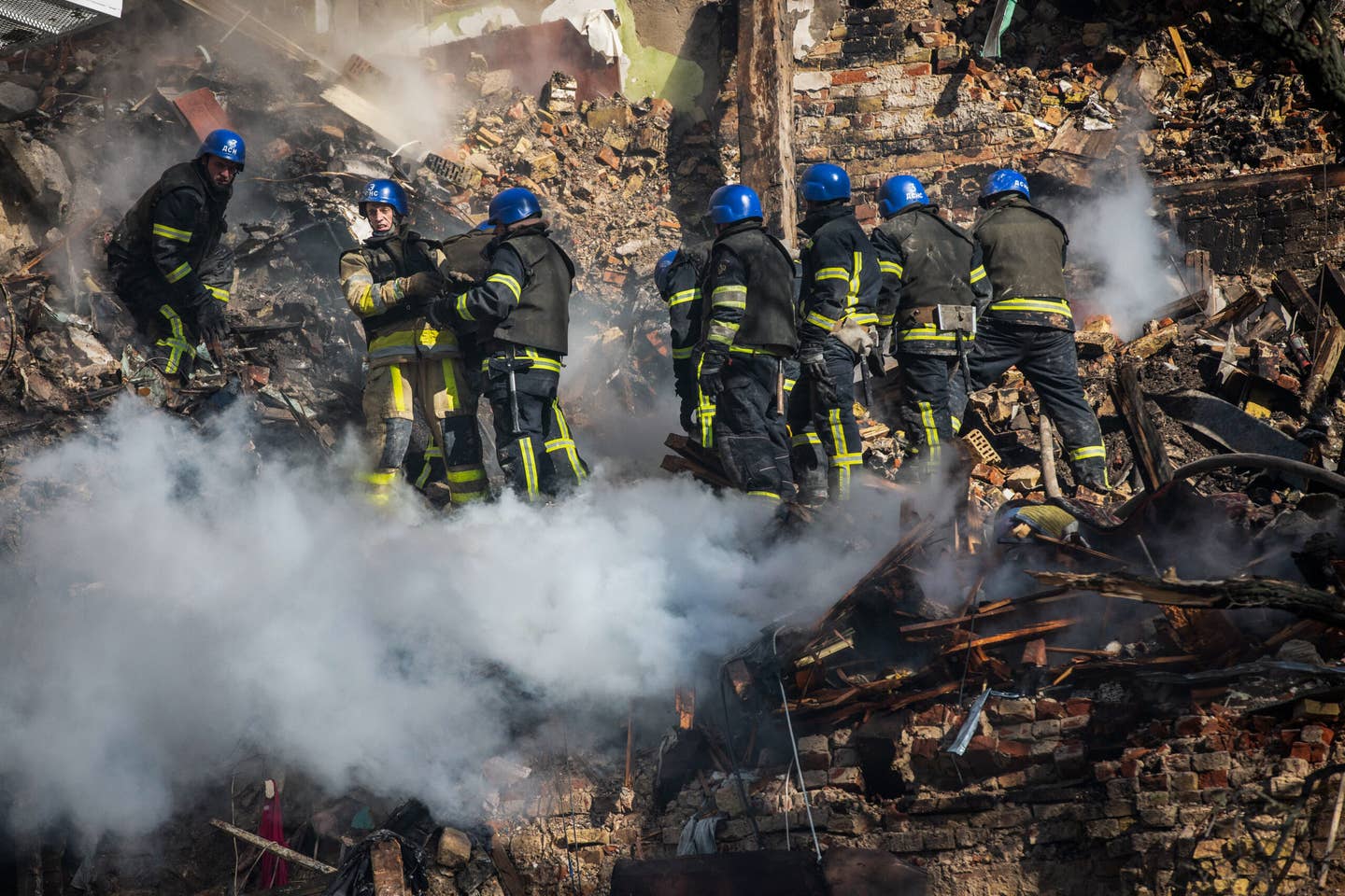 Ukrainian rescuers work at the site of a residential building in Kyiv destroyed by an Iranian-made Shahed-136 loitering munition. <em>Photo by Oleksii Chumachenko/SOPA Images/LightRocket via Getty Images</em>