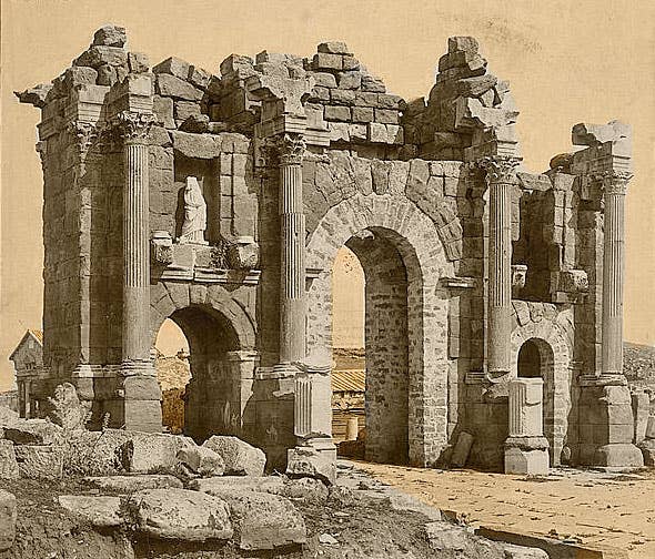 Roman Arch of Trajan at Thamugadi (Timgad), Algeria, 1800s.<em> Library of Congress via Wikimedia Commons</em>
