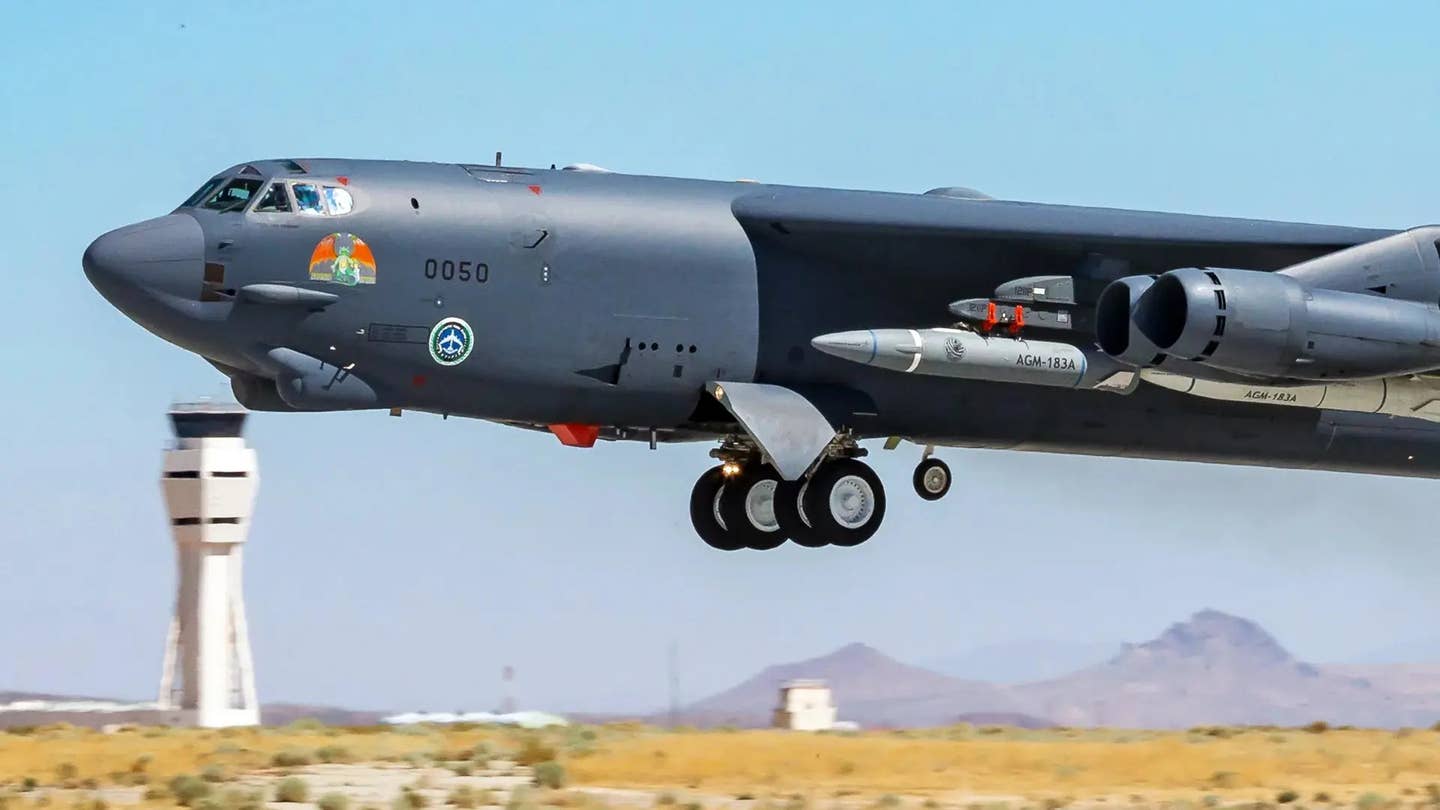 A B-52 bomber carrying AGM-183A Air-launched Rapid Response Weapon (ARRW) hypersonic missile test articles under its wing. This missile has failed in multiple flight tests and the Air Force is now looking to cancel the program entirely. <em>USAF</em>