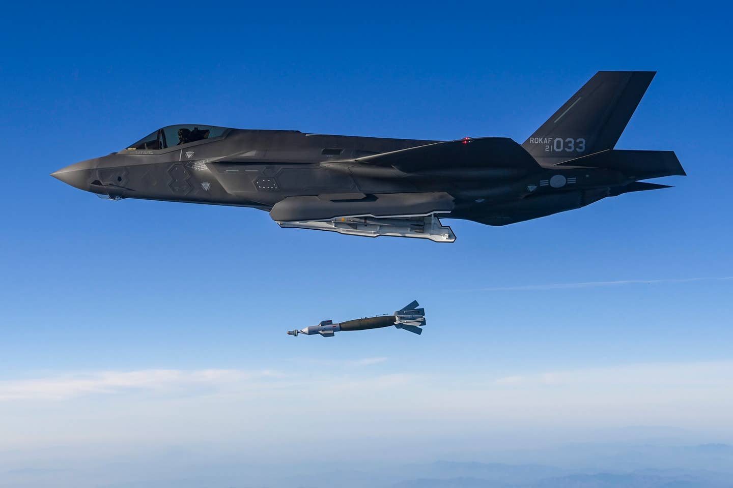 A Republic of Korea Air Force F-35A stealth fighter drops a laser-guided bomb during joint air drills in response to the North Korean intercontinental ballistic missile (ICBM) test launch on November 18, 2022. <em>Photo by South Korean Defense Ministry via Getty Images</em>