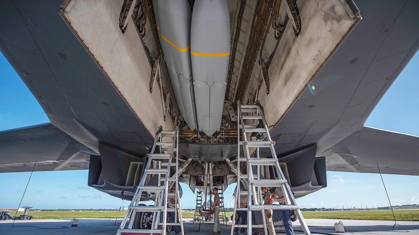 Live AGM-158 JASSM missiles seen loaded onto a rotary launcher inside a B-1B's bomb bay. <em>USAF</em>