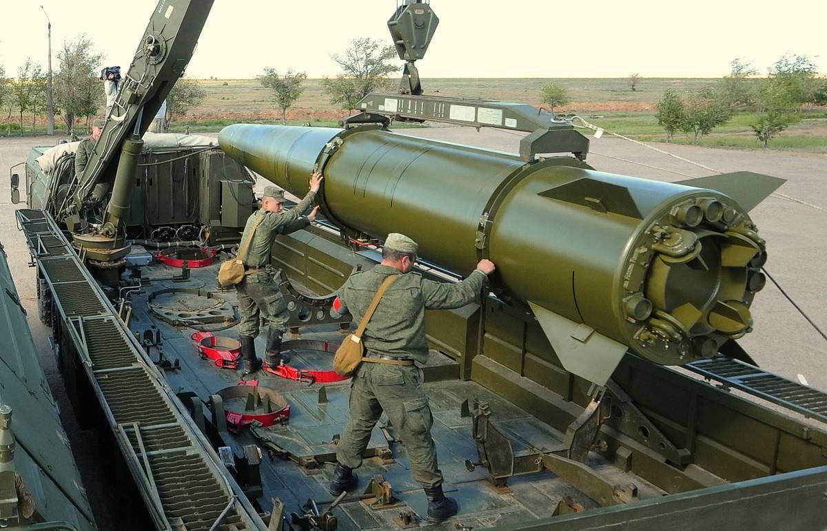 A Russian Iskander-M missile is seen being loaded. These tactical ballistic missiles could deploy low-yield nuclear warheads. (Russian MOD)
