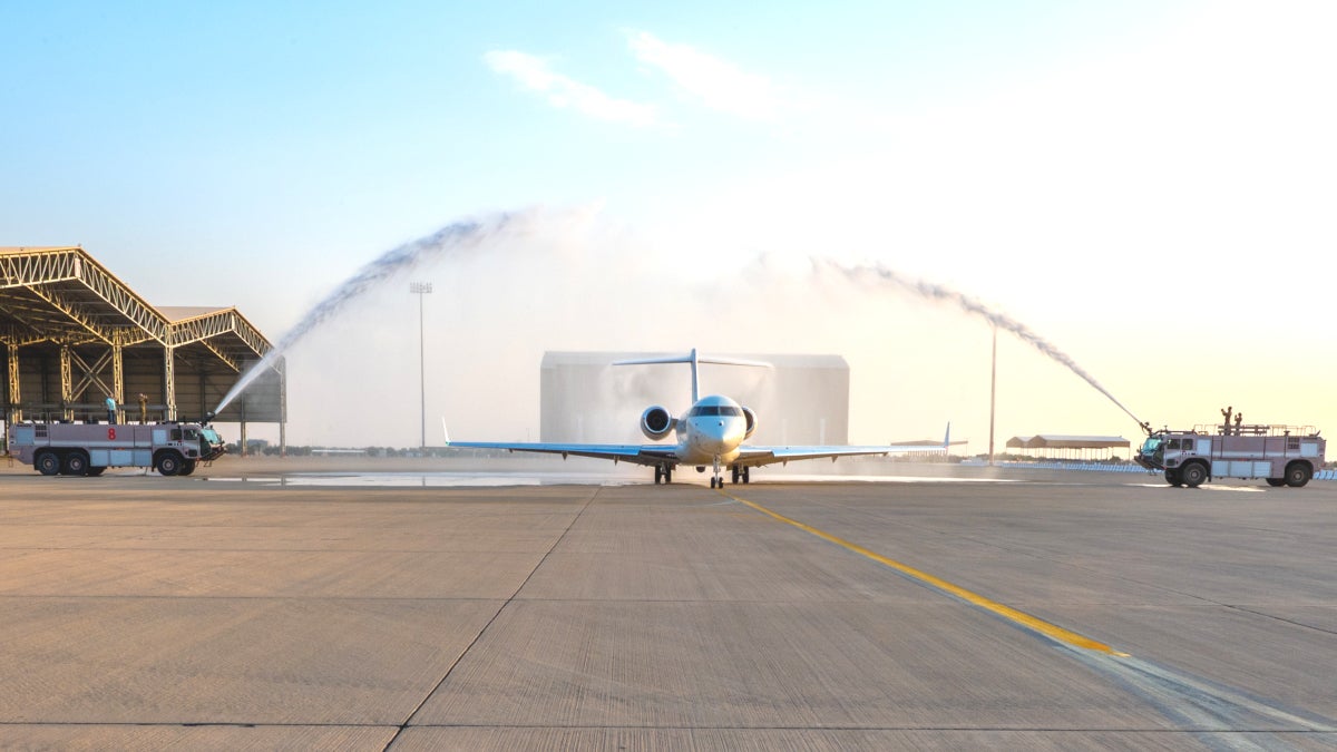 A new U.S. Air Force E-11A BACN aircraft taxis through a "bird bath" at Prince Sultan Air Base, Kingdom of Saudi Arabia, Dec. 17, 2022. This E-11A is the newest addition to 430th Expeditionary Electronic Communications Squadron's fleet. Commonly known as Battlefield Airborne Communications Node, or BACN, this aircraft extends the range of communications channels and enables better communication amongst units. (U.S. Air Force photo by Staff Sgt. Shannon Bowman)