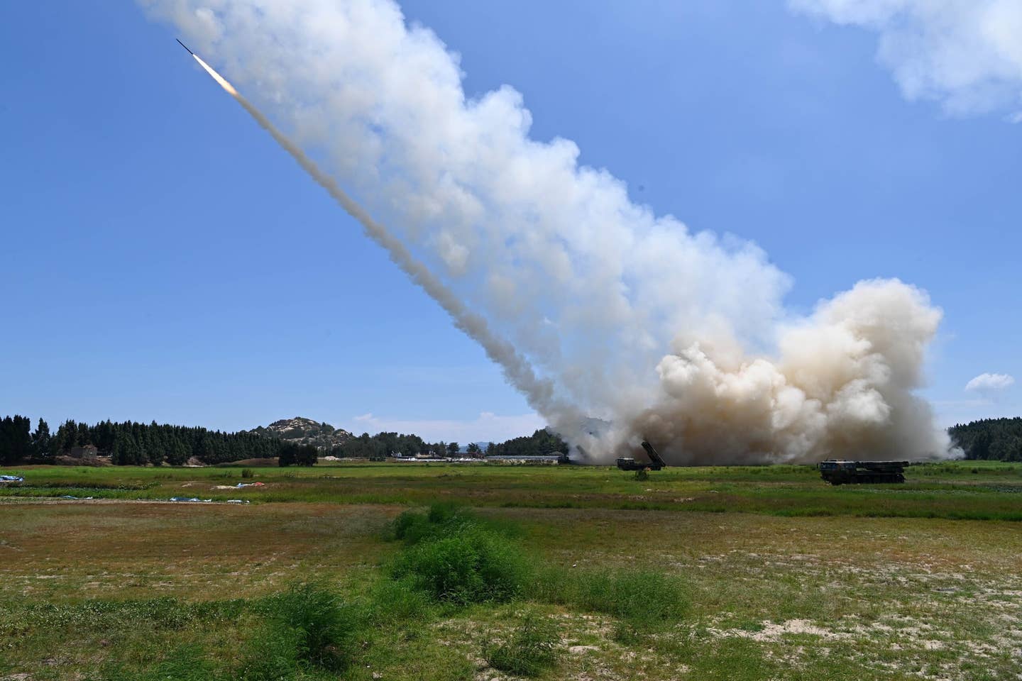 Rocket artillery units from the Eastern Theater Command of the Chinese PLA conduct long-range live-fire drills close to the Taiwan Strait, on August 4, 2022. <em>Photo by Lai Qiaoquan/Xinhua via Getty Images</em>